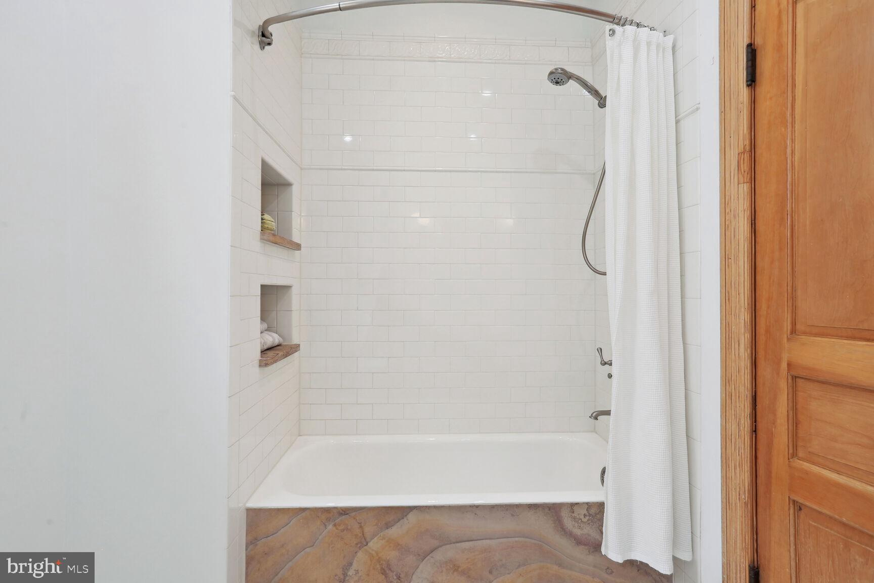 1219 Constitution Avenue Northeast Washington, DC 20002 - Photo 17 of 38 Hall tub shower W/ Brazilian granite on the side