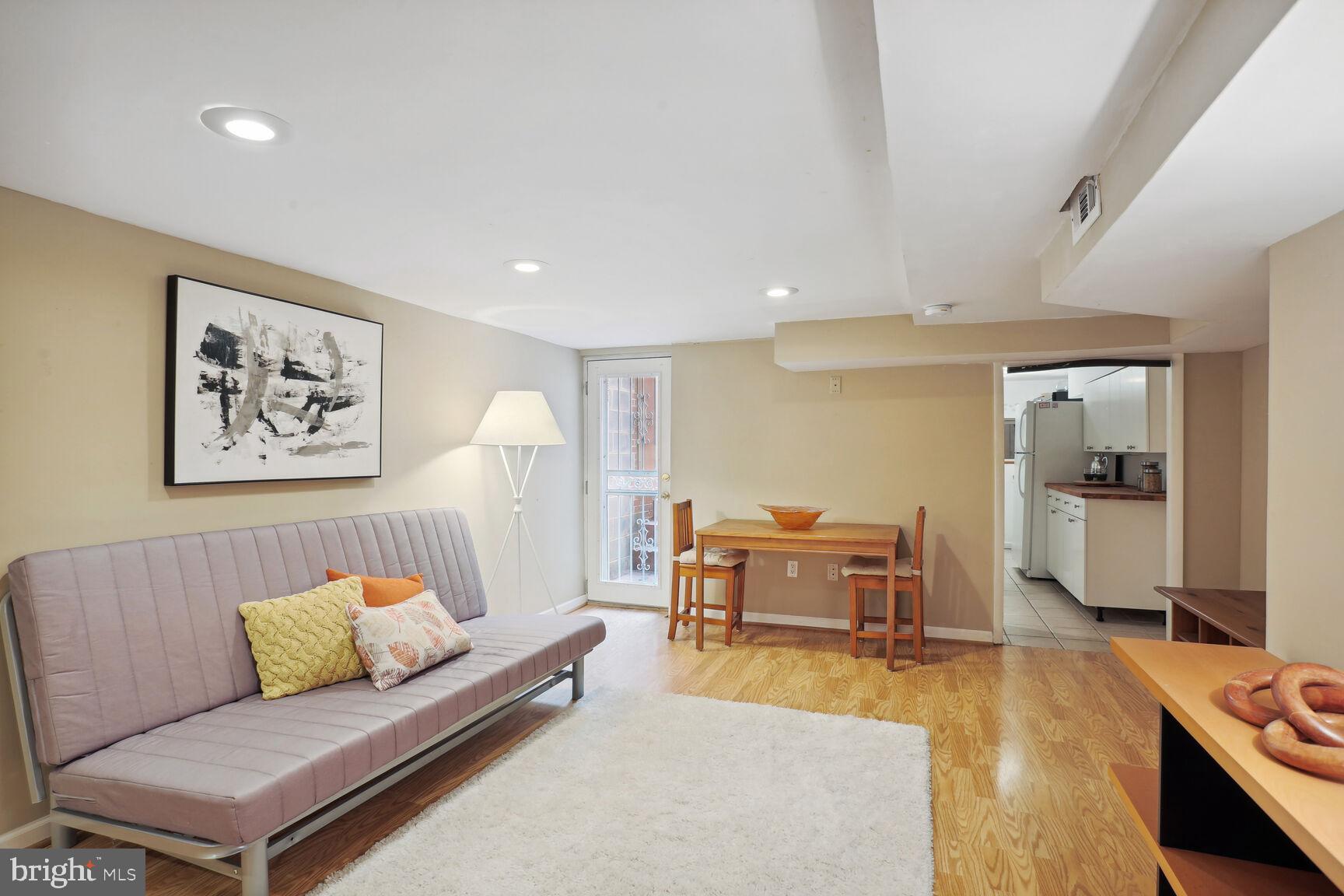 1219 Constitution Avenue Northeast Washington, DC 20002 - Photo 19 of 38 Living and dining room in English basement