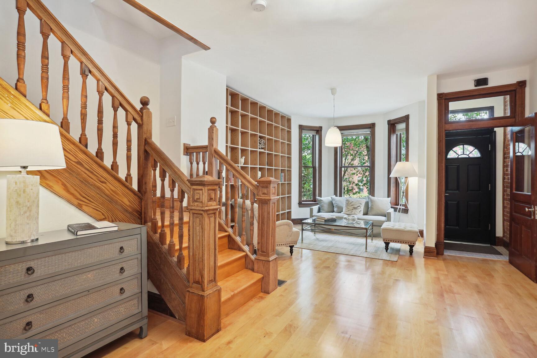 1219 Constitution Avenue Northeast Washington, DC 20002 - Photo 2 of 38 Living room w/bay windows and central staircase