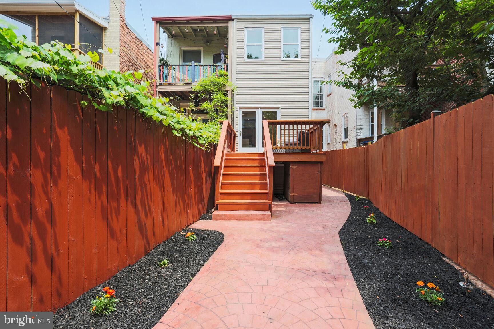 1219 Constitution Avenue Northeast Washington, DC 20002 - Photo 27 of 38 Fenced backyard w/tiled patio + access to basement