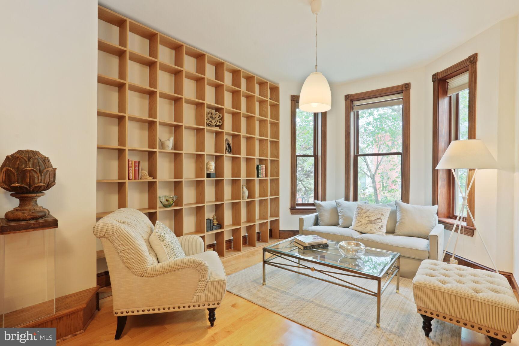 1219 Constitution Avenue Northeast Washington, DC 20002 - Photo 3 of 38 Living room w/ built-ins + gleaming maple hardwood
