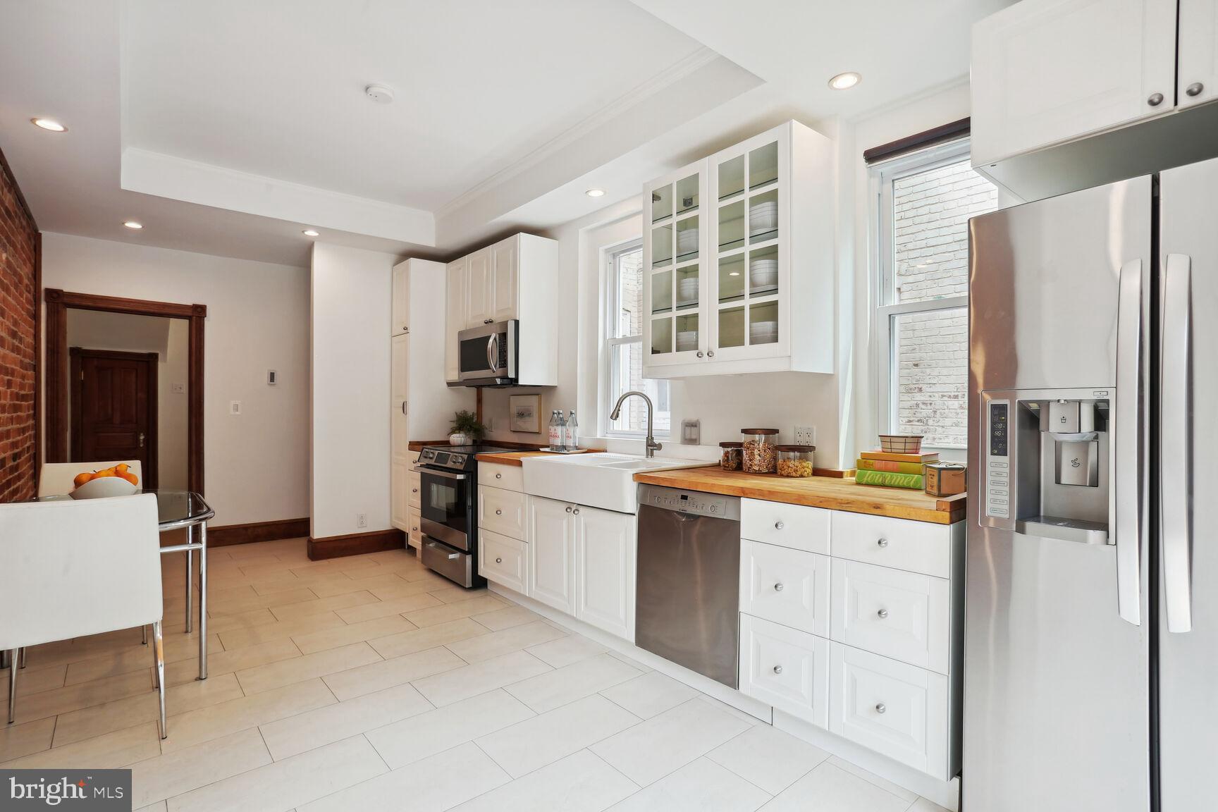 1219 Constitution Avenue Northeast Washington, DC 20002 - Photo 8 of 38 Sunny eat-in Kitchen with excellent storage