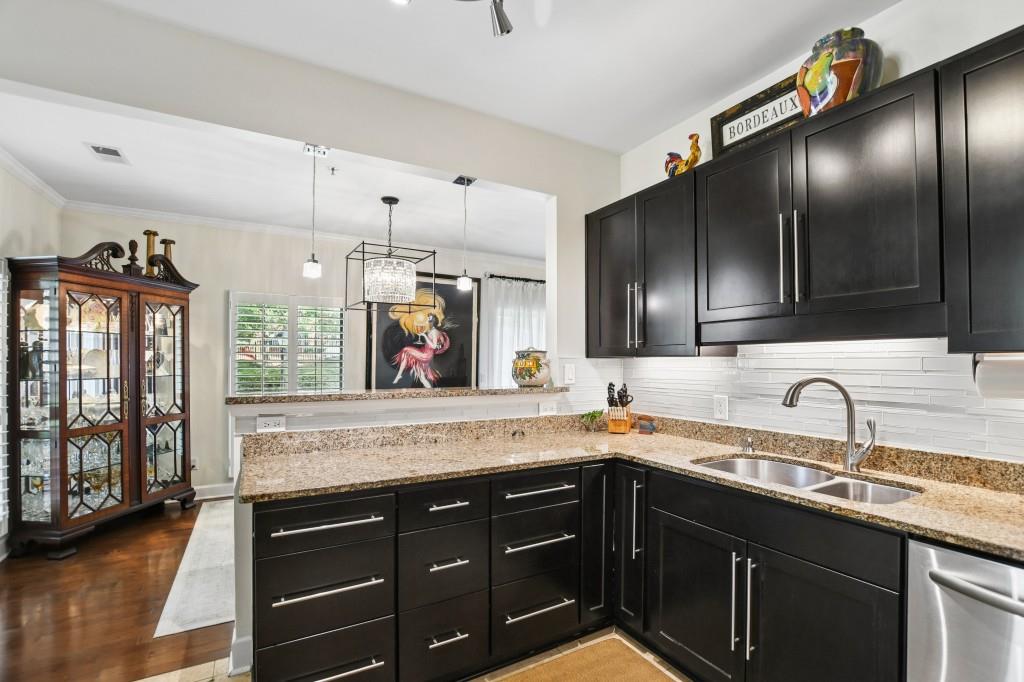 2921 Lenox Road Northeast, Unit 103 Atlanta, GA 30324 - Photo 13 of 37 a kitchen with a sink and cabinets