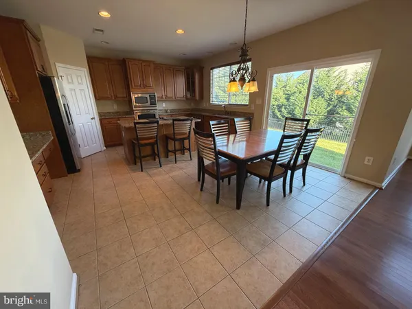 a kitchen with stainless steel appliances granite countertop sink stove top oven and cabinets