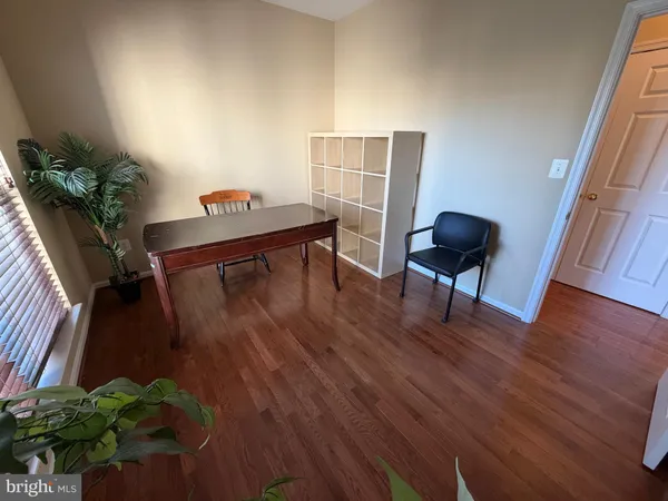 a view of a livingroom with furniture and a potted plant
