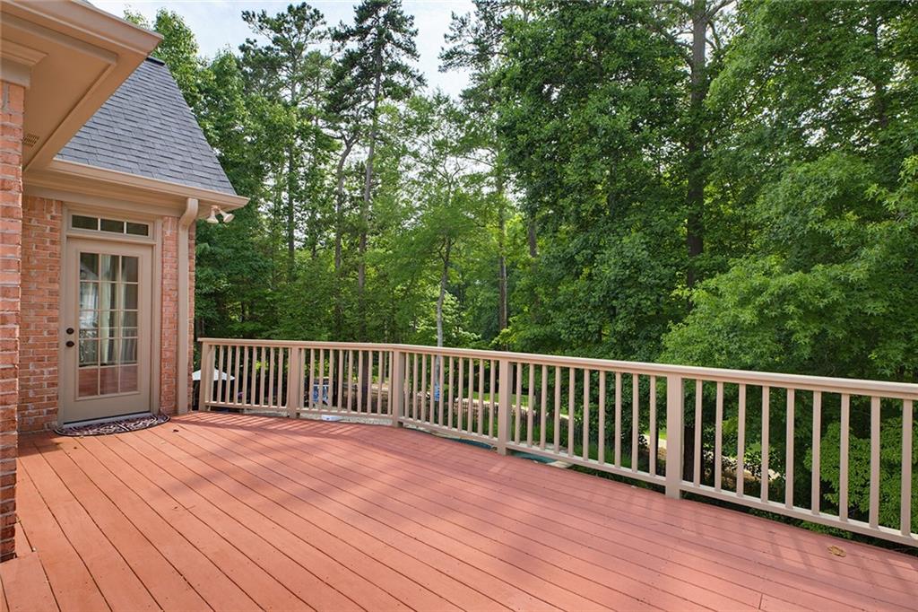 14442 Club Circle Milton, GA 30004 - Photo 31 of 82 a view of backyard with deck and wooden floor