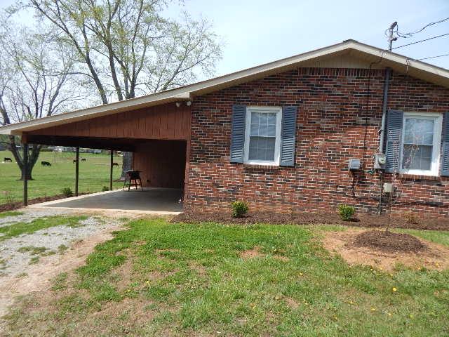 321 Hennessee Bridge Road Rock Island, TN 38581 - Photo 2 of 22 Carport with large storage shed attached