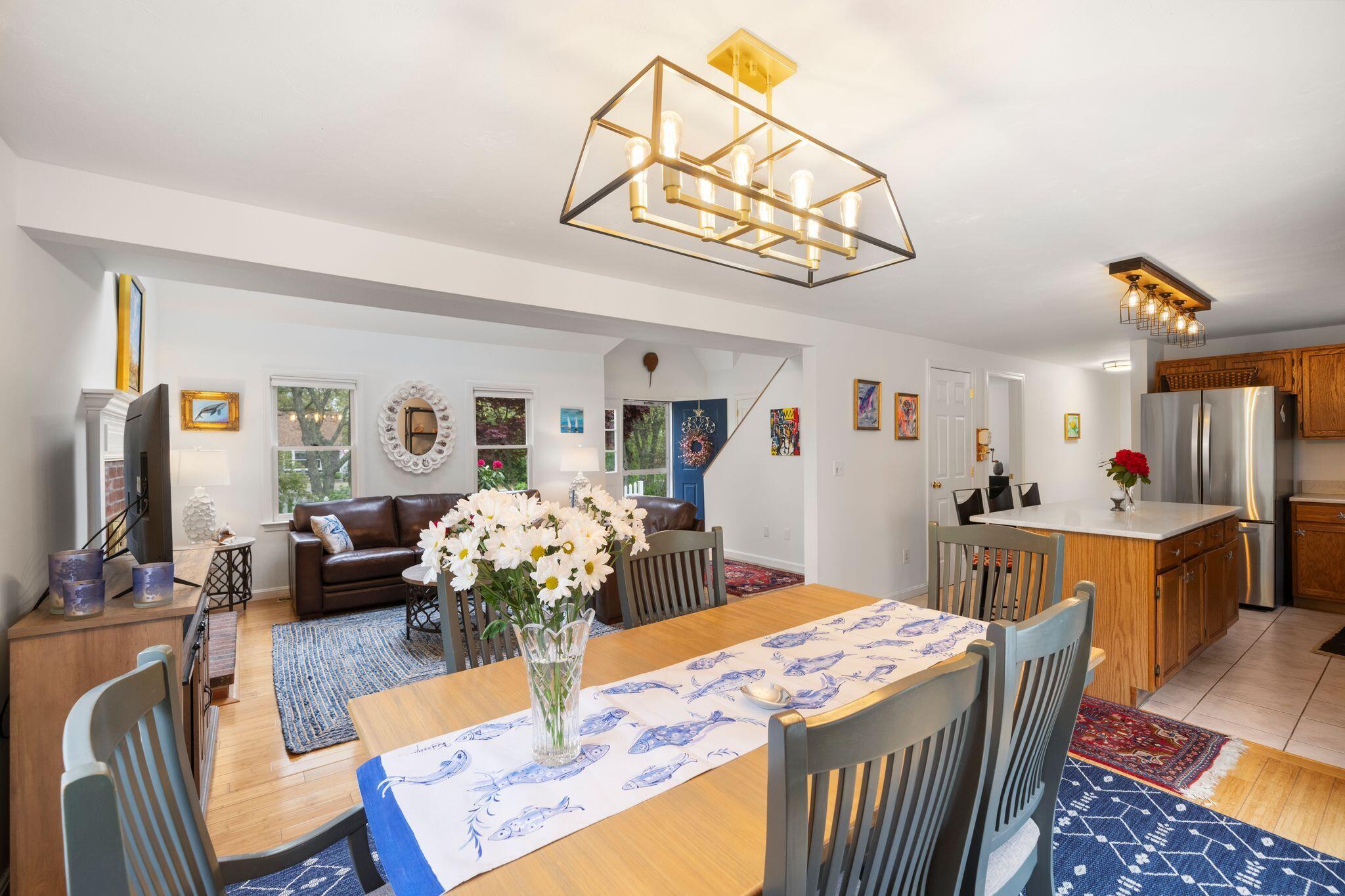 40 Sam Ryder Road Chatham, MA 02633 - Photo 13 of 42 a view of a dining room with furniture a chandelier and wooden floor
