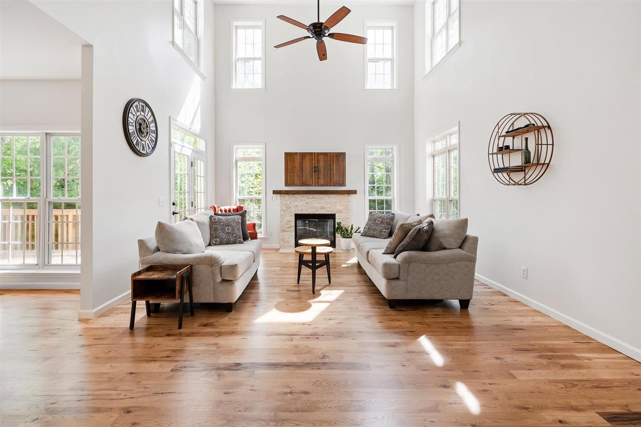 110 Sturdivant Road Durham, NC 27705 - Photo 2 of 30 Beautiful hickory wood floors throughout the main level. Custom TV built-in above fireplace. Living Room