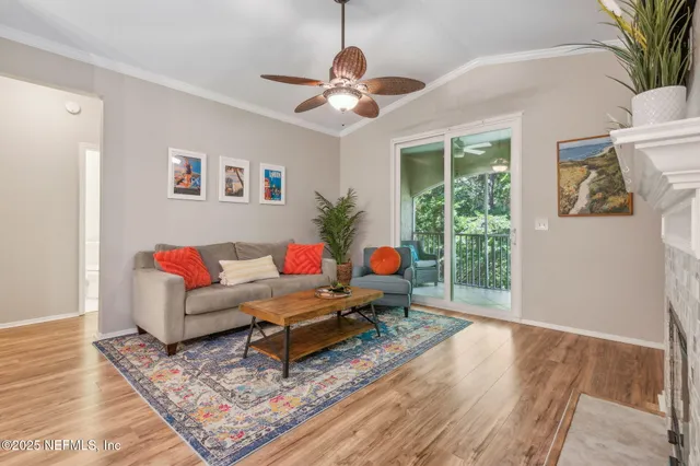 a view of a livingroom with furniture and wooden floor