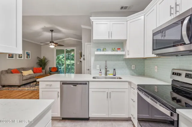 a bedroom with a bed and cabinets