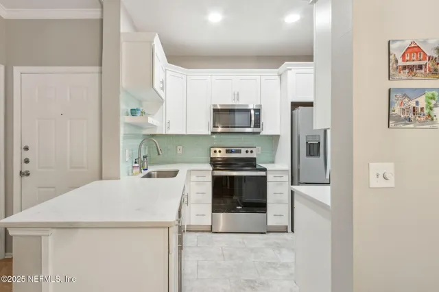 a view of backyard with swimming pool and outdoor seating