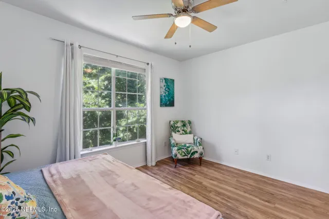 a living room with fireplace furniture and a flat screen tv