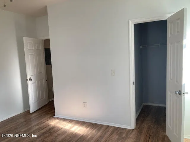 a kitchen with a refrigerator sink and cabinets