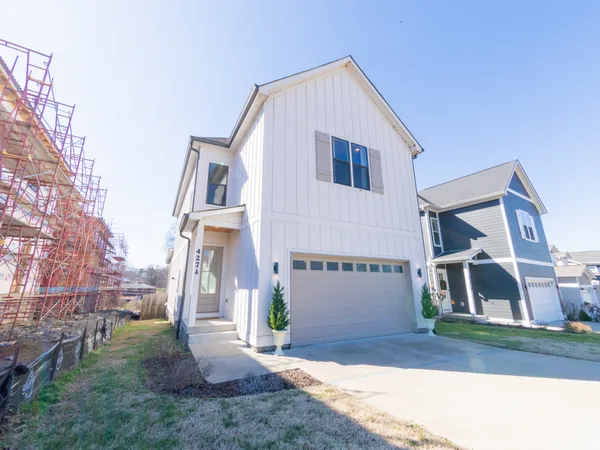 a view of house and a yard
