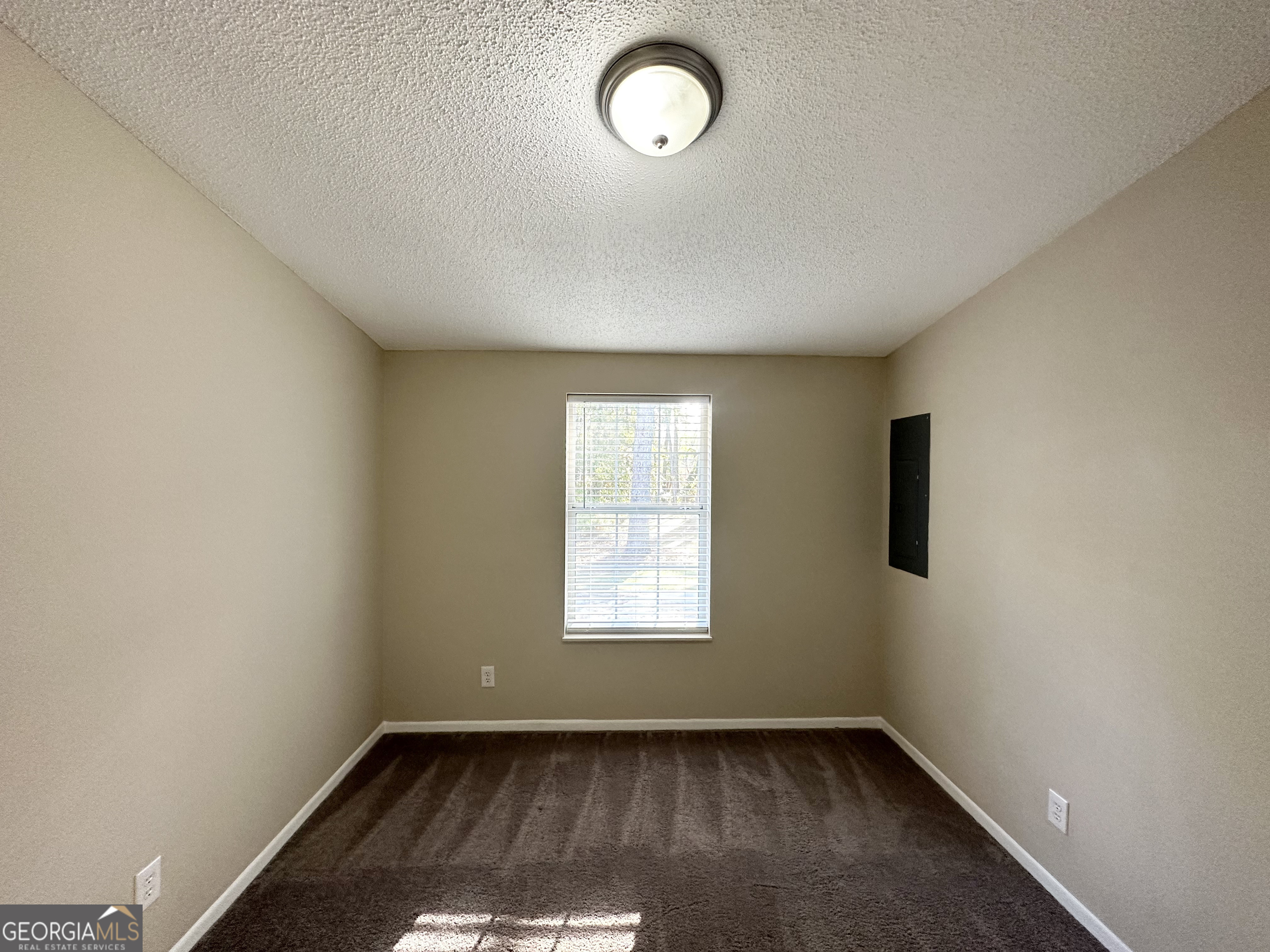 7125 Rhodes Street Lithonia, GA 30058 - Photo 17 of 30 an empty room with a window