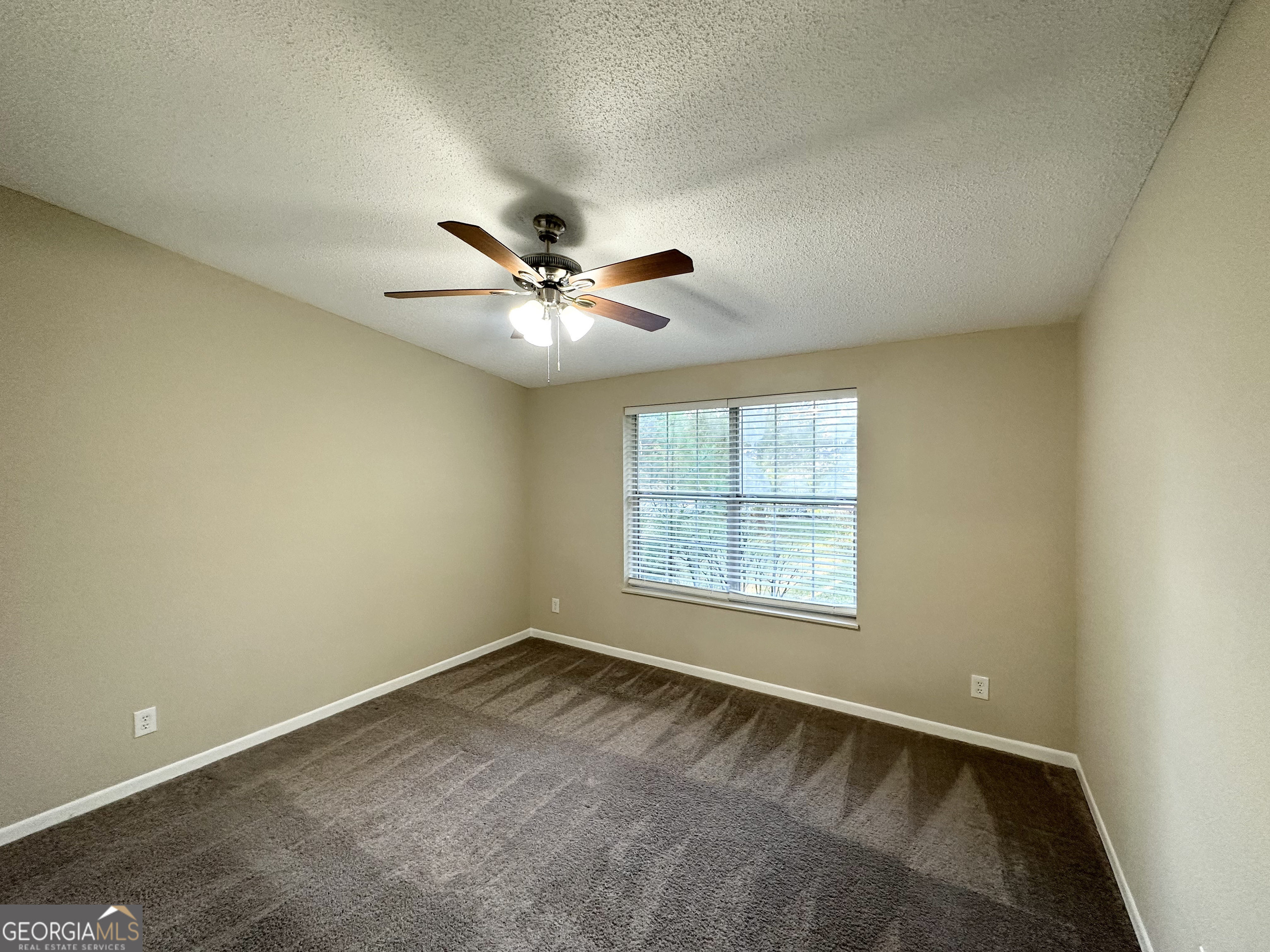 7125 Rhodes Street Lithonia, GA 30058 - Photo 23 of 30 an empty room with a window