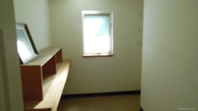 a view of stairs and utility room