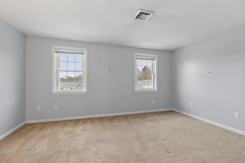 48 Fox Meadow Road, Unit F Leominster, MA 01453 - Photo 15 of 36 an empty room with a window
