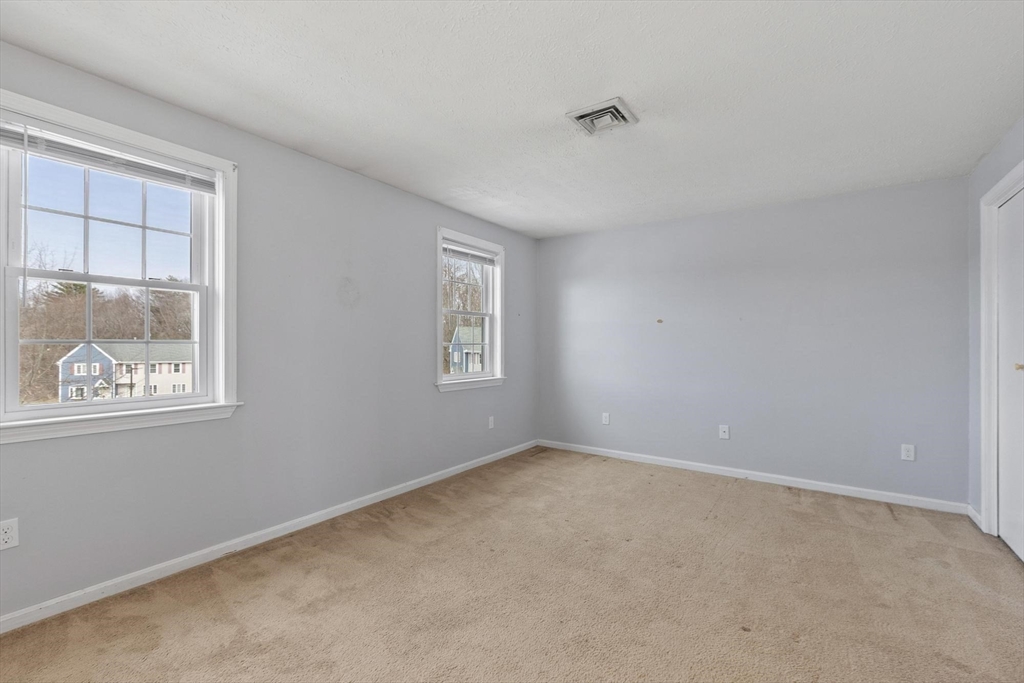 48 Fox Meadow Road, Unit F Leominster, MA 01453 - Photo 17 of 36 a view of an empty room with a window