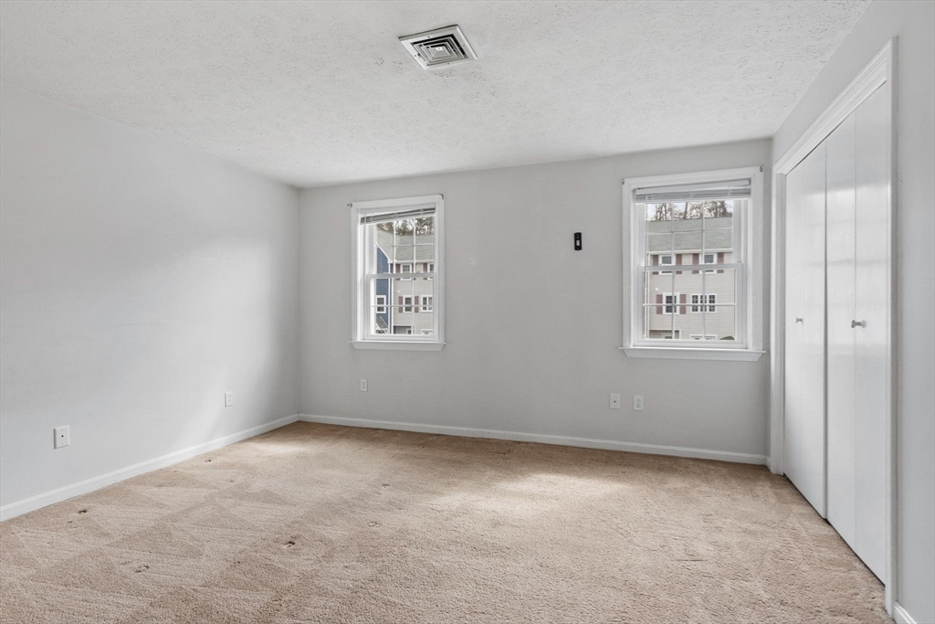 48 Fox Meadow Road, Unit F Leominster, MA 01453 - Photo 18 of 36 an empty room with windows