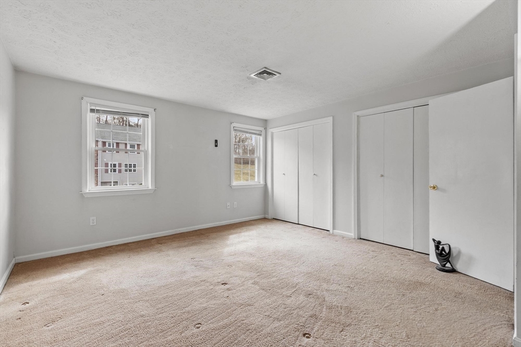 48 Fox Meadow Road, Unit F Leominster, MA 01453 - Photo 20 of 36 a view of an empty room with a window