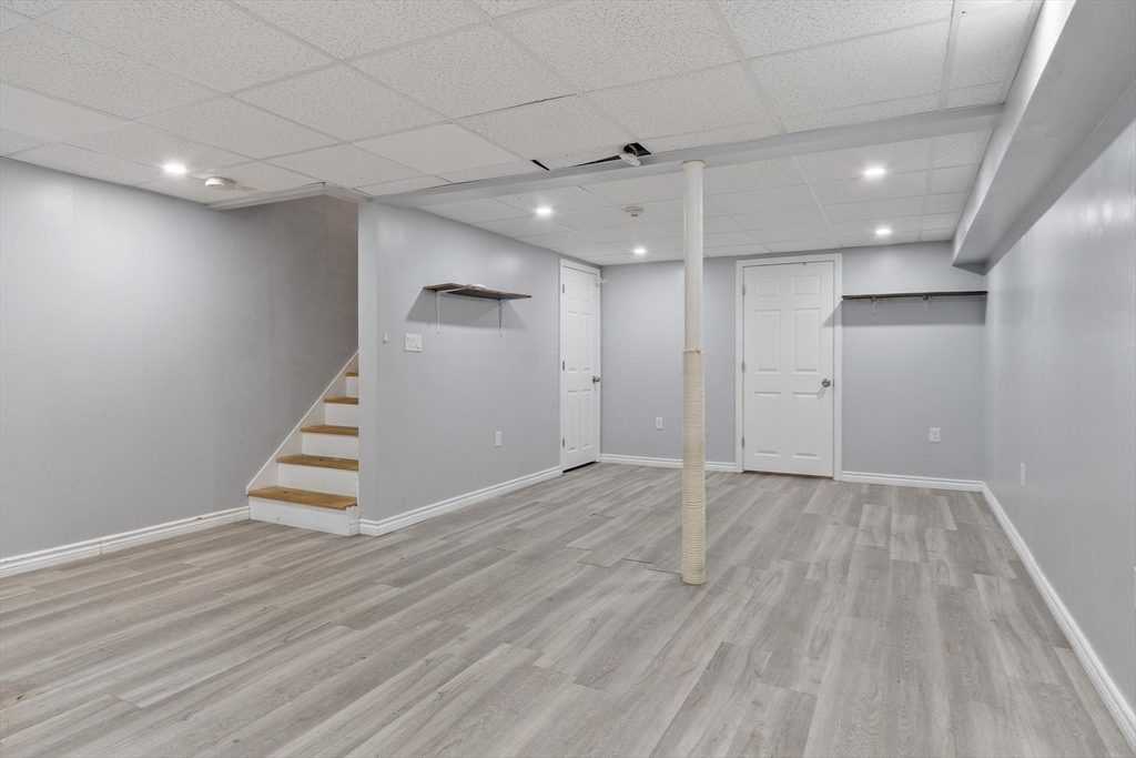 48 Fox Meadow Road, Unit F Leominster, MA 01453 - Photo 21 of 36 an empty room with wooden floor and entryway