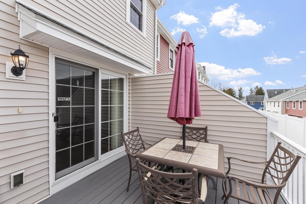48 Fox Meadow Road, Unit F Leominster, MA 01453 - Photo 28 of 36 a view of a two chairs and table in the balcony