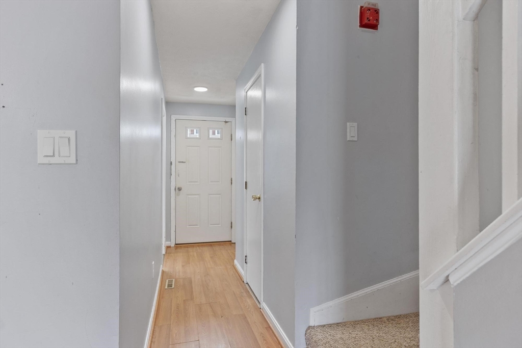 48 Fox Meadow Road, Unit F Leominster, MA 01453 - Photo 6 of 36 a view of a hallway with wooden floor