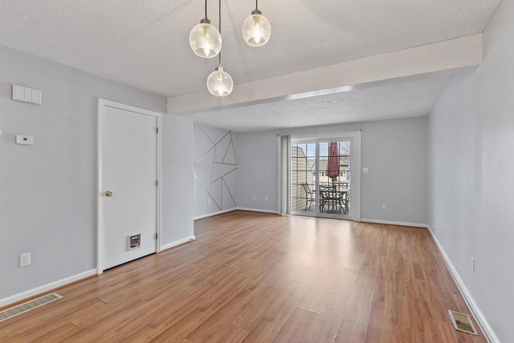 48 Fox Meadow Road, Unit F Leominster, MA 01453 - Photo 8 of 36 a view of a room with wooden floor and window