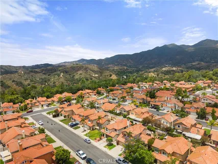 an aerial view of houses with a swimming pool