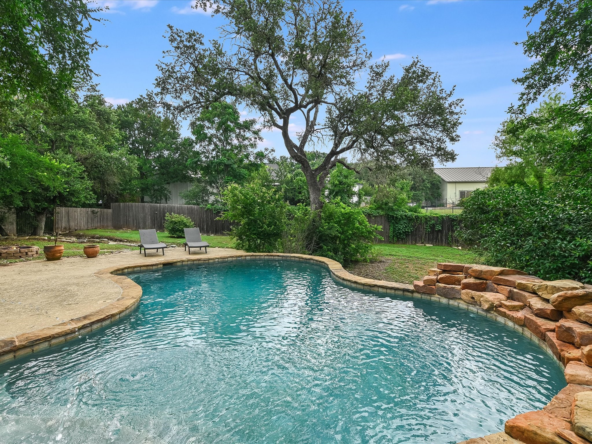15214 Nightingale Lane Austin, TX 78734 - Photo 1 of 28 a view of a swimming pool with a patio