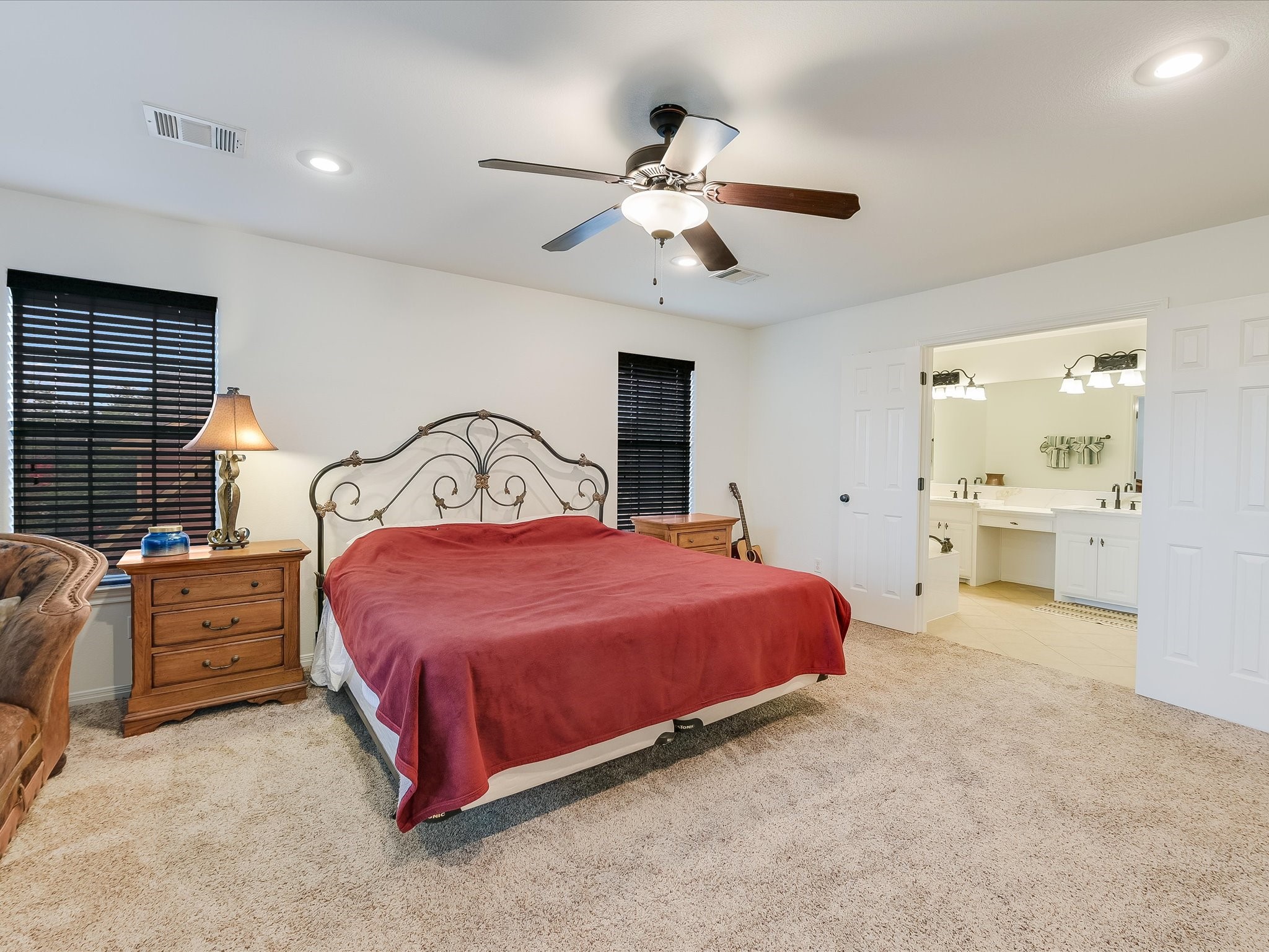 15214 Nightingale Lane Austin, TX 78734 - Photo 13 of 28 a bedroom with a bed and window