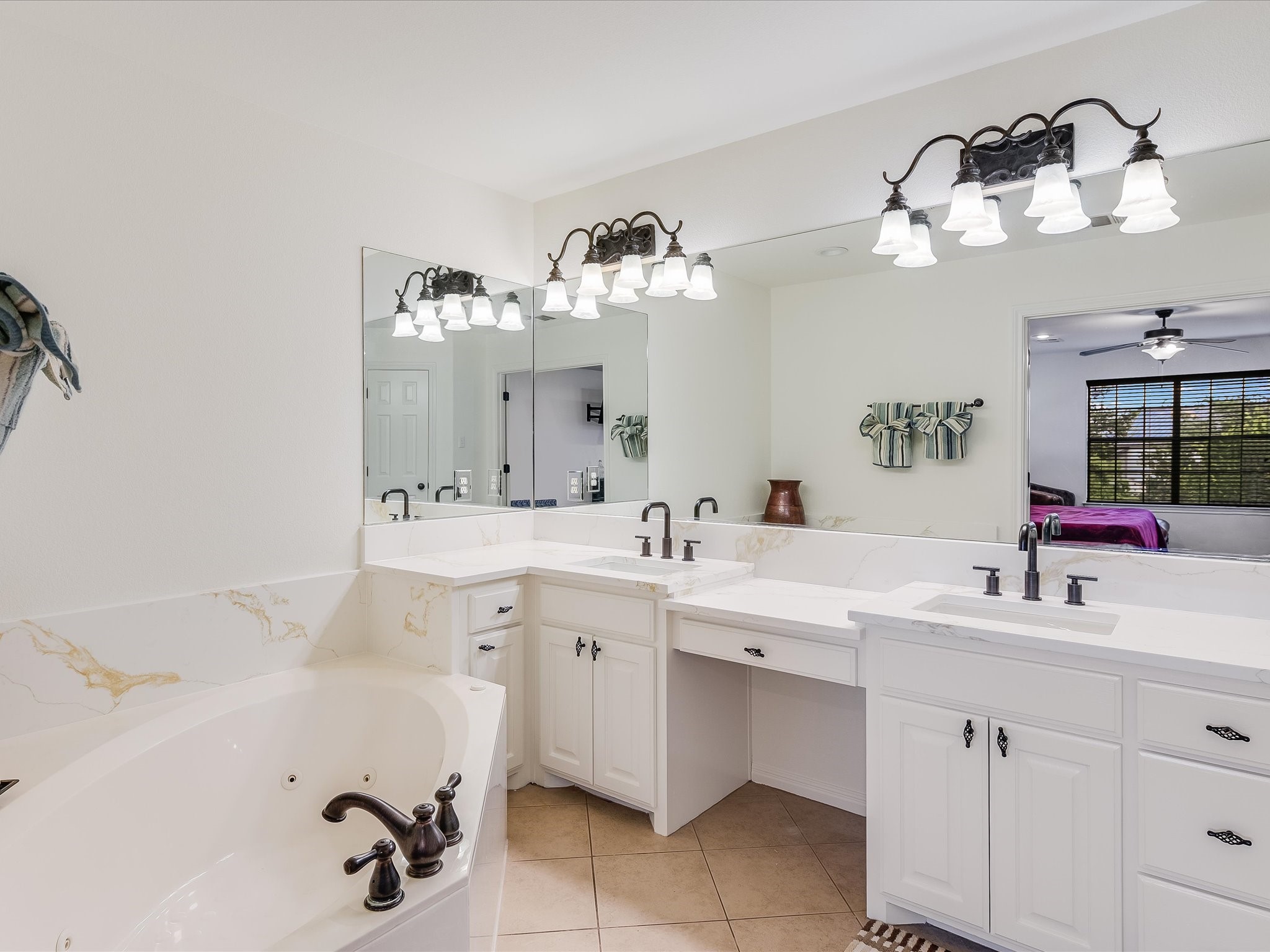 15214 Nightingale Lane Austin, TX 78734 - Photo 15 of 28 a bathroom with a sink vanity and a mirror