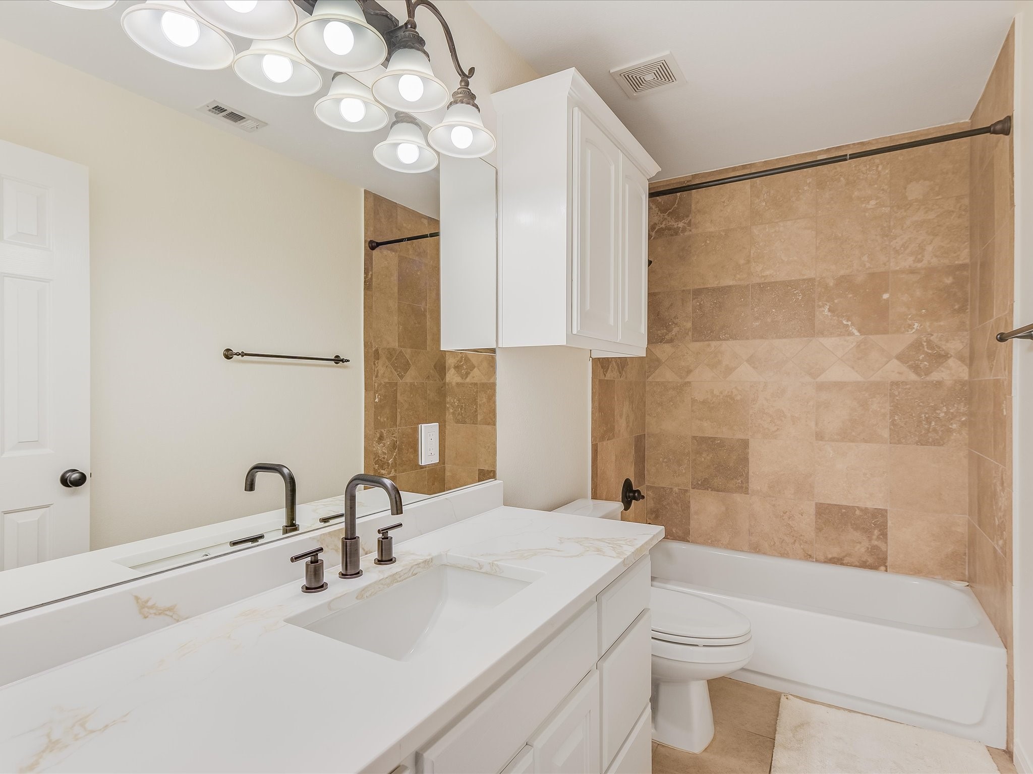 15214 Nightingale Lane Austin, TX 78734 - Photo 18 of 28 a bathroom with a sink a toilet and shower