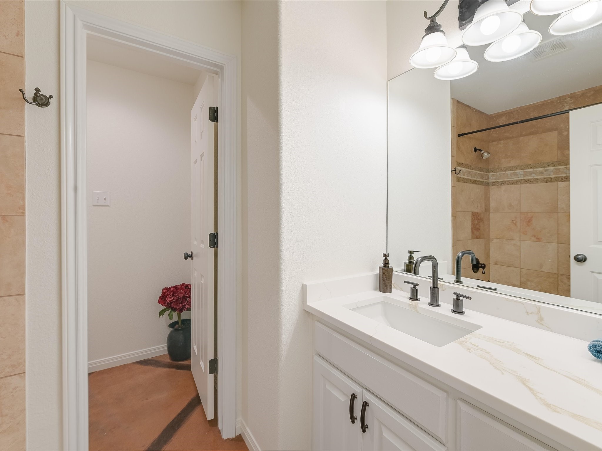 15214 Nightingale Lane Austin, TX 78734 - Photo 21 of 28 a bathroom with a sink vanity granite and a mirror