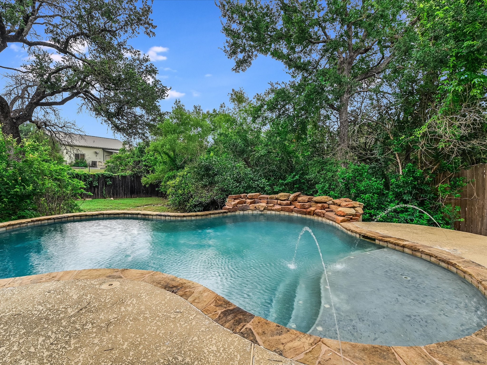 15214 Nightingale Lane Austin, TX 78734 - Photo 25 of 28 a view of a swimming pool with a yard