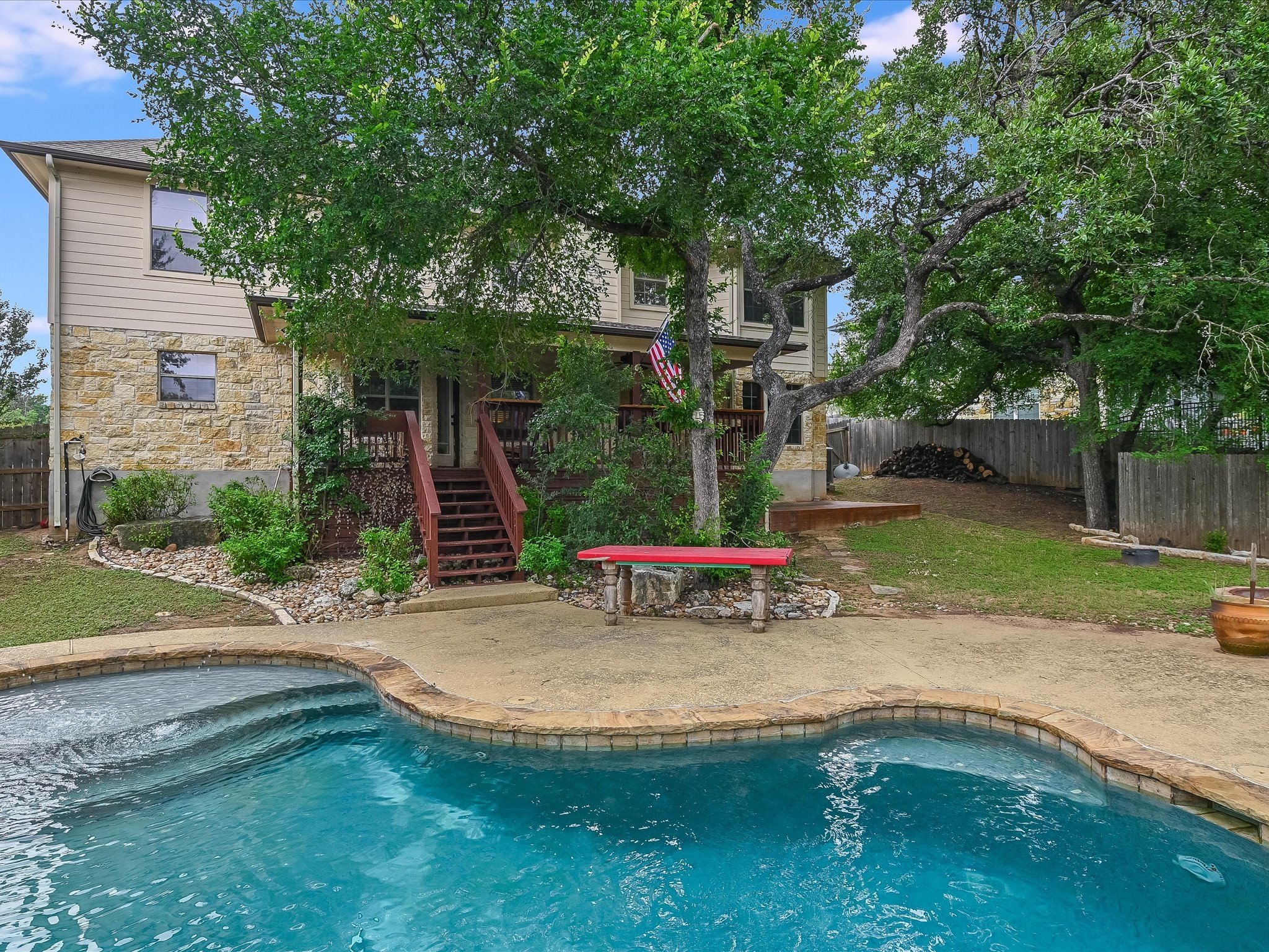 15214 Nightingale Lane Austin, TX 78734 - Photo 26 of 28 a view of a chair and table in backyard of the house