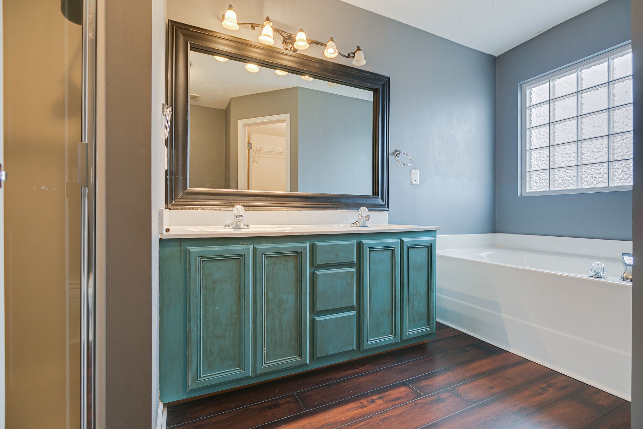 1905 Portway Road Spring Hill, TN 37174 - Photo 22 of 28 a bathroom with a tub sink and mirror