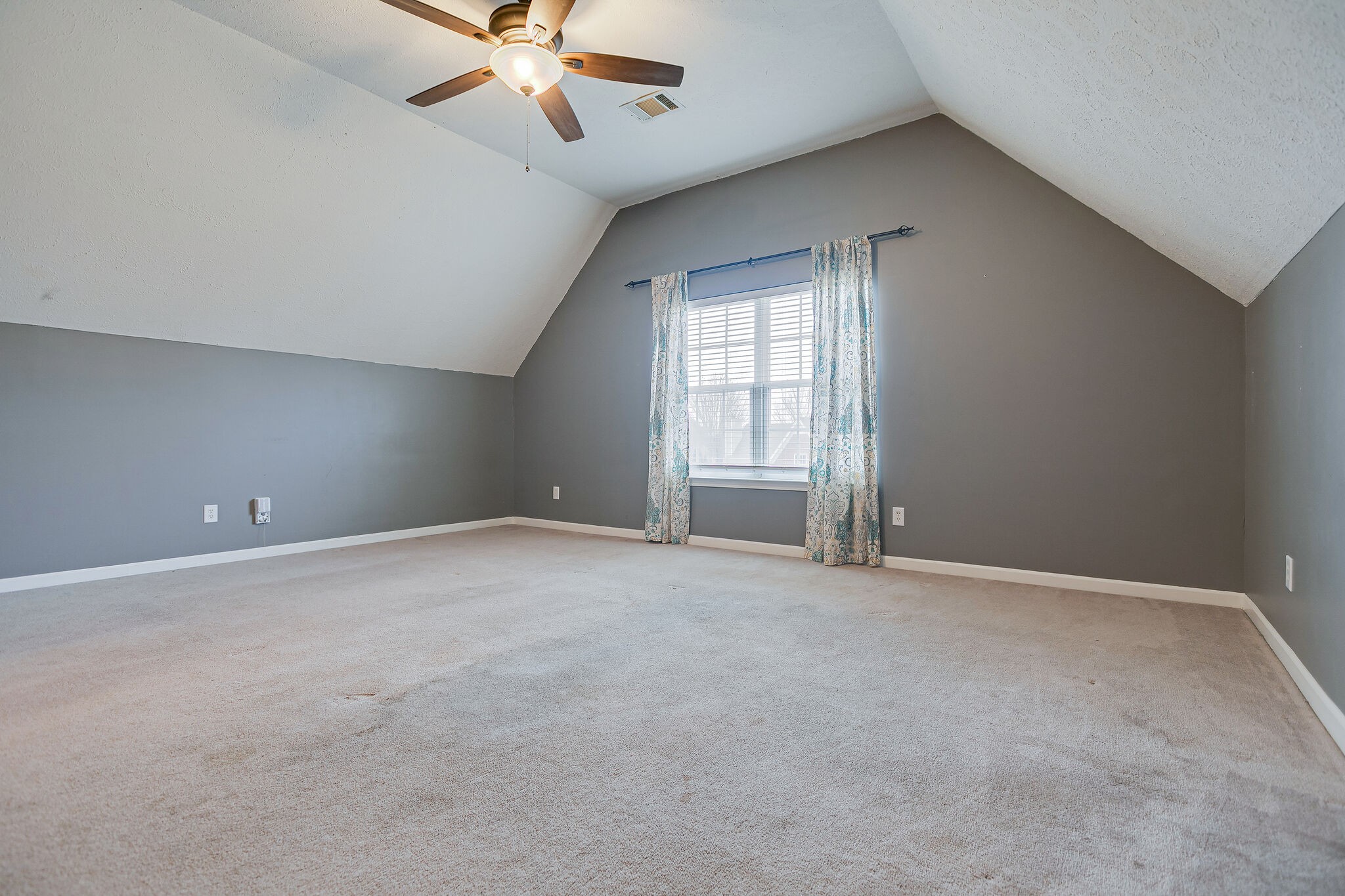 1905 Portway Road Spring Hill, TN 37174 - Photo 23 of 28 an empty room with a ceiling fan and window