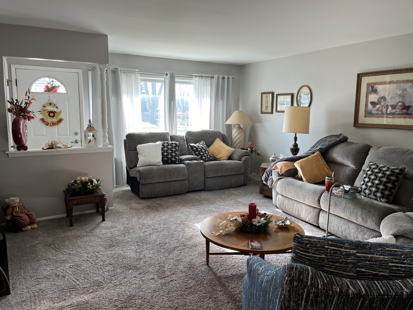 213 School Avenue Rochelle, IL 61068 - Photo 2 of 26 a living room with furniture and a chandelier