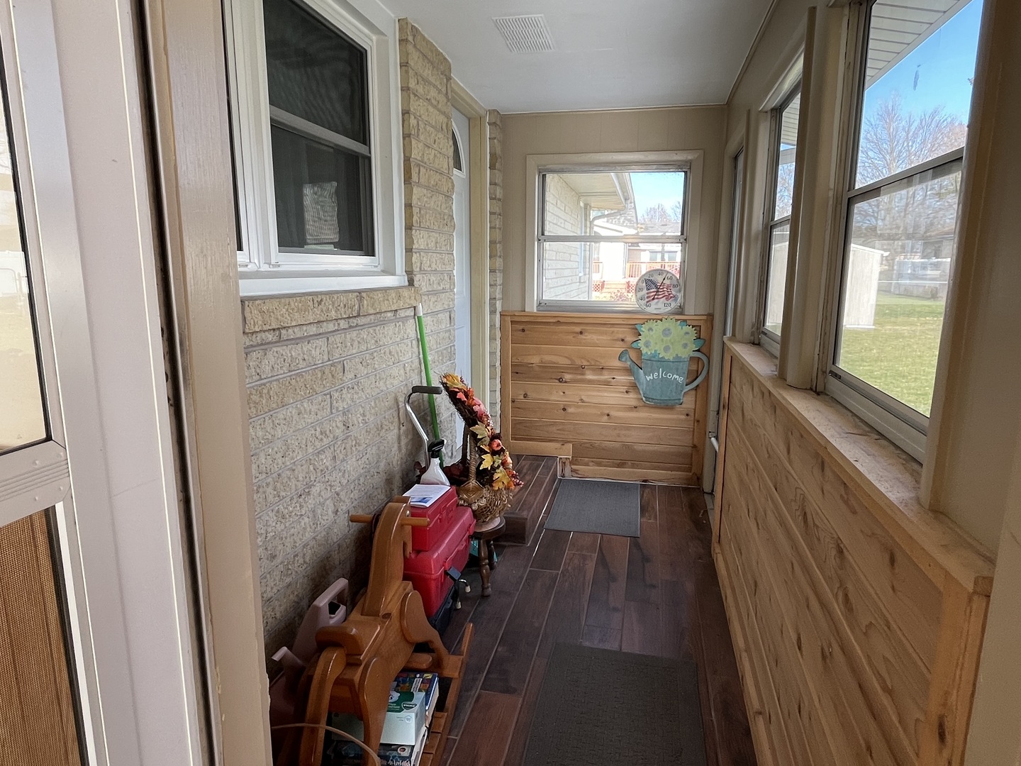 213 School Avenue Rochelle, IL 61068 - Photo 22 of 26 a view of a room with wooden floor and furniture