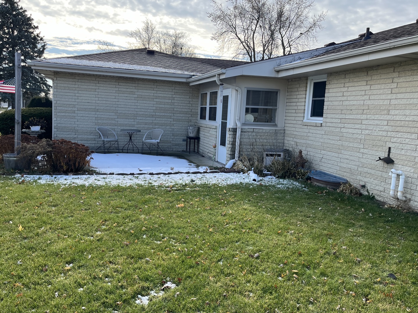 213 School Avenue Rochelle, IL 61068 - Photo 23 of 26 a front view of a house with garden
