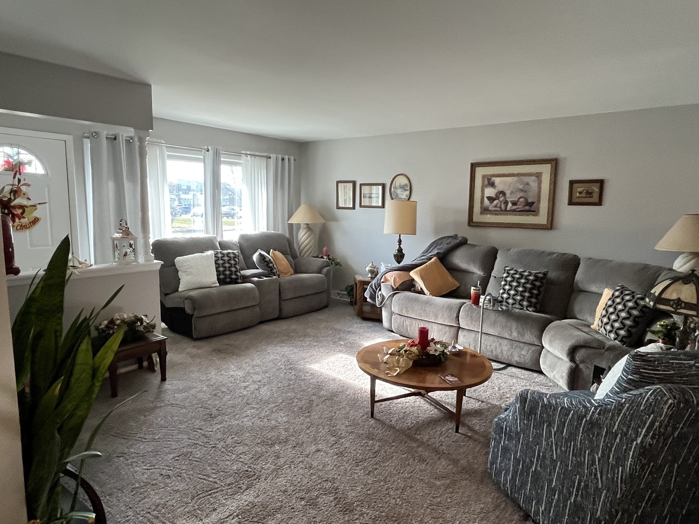 213 School Avenue Rochelle, IL 61068 - Photo 3 of 26 a living room with furniture a couch and a flat screen tv