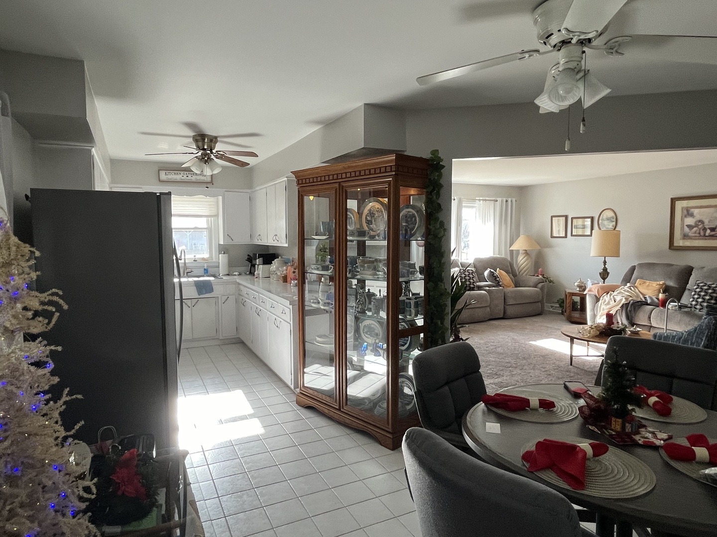 213 School Avenue Rochelle, IL 61068 - Photo 7 of 26 a living room with furniture and a chandelier