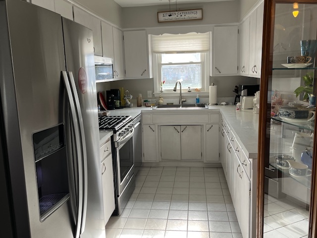 213 School Avenue Rochelle, IL 61068 - Photo 8 of 26 a kitchen with a refrigerator sink and stove