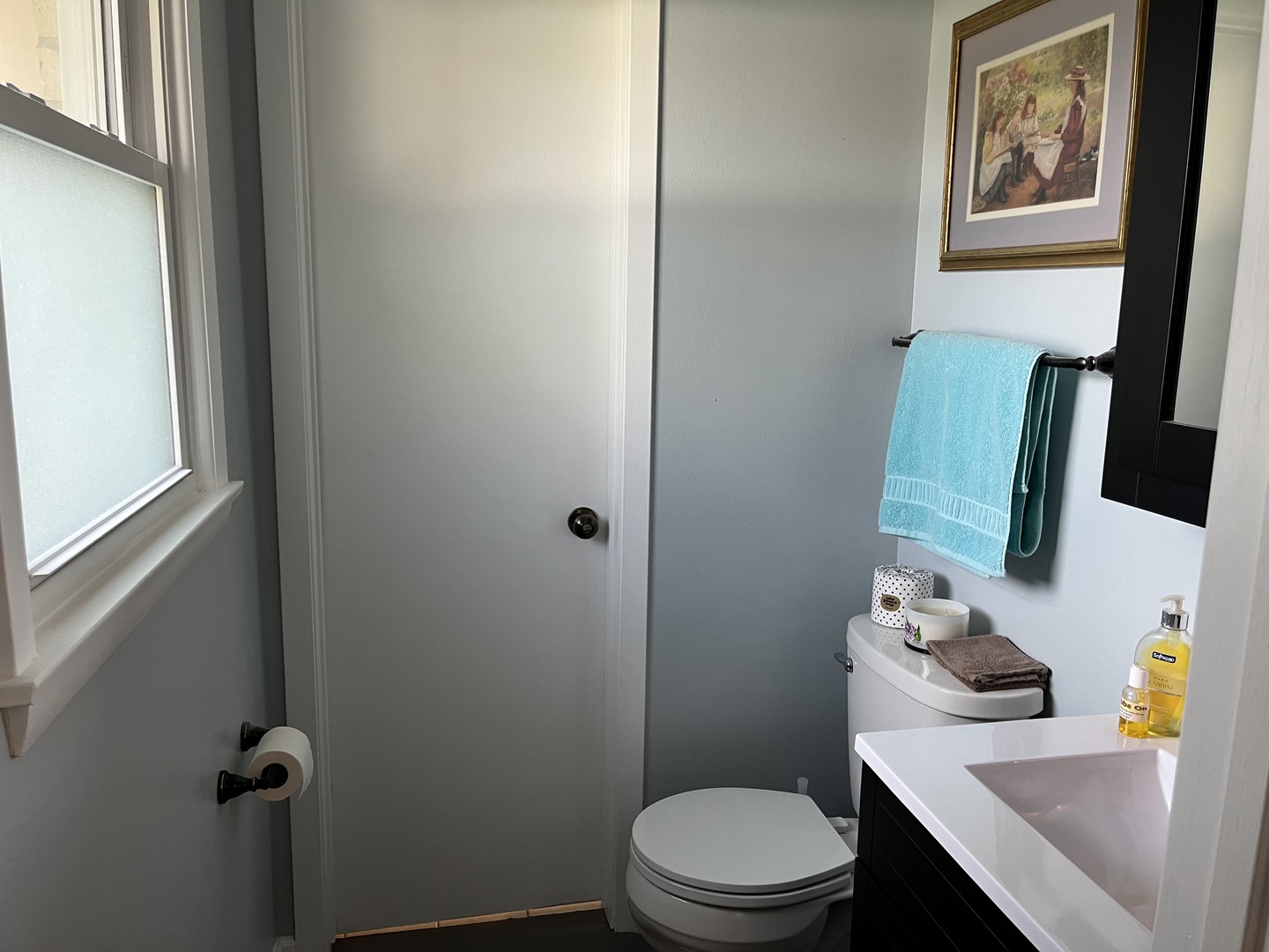 213 School Avenue Rochelle, IL 61068 - Photo 9 of 26 a bathroom with a sink vanity mirror and toilet