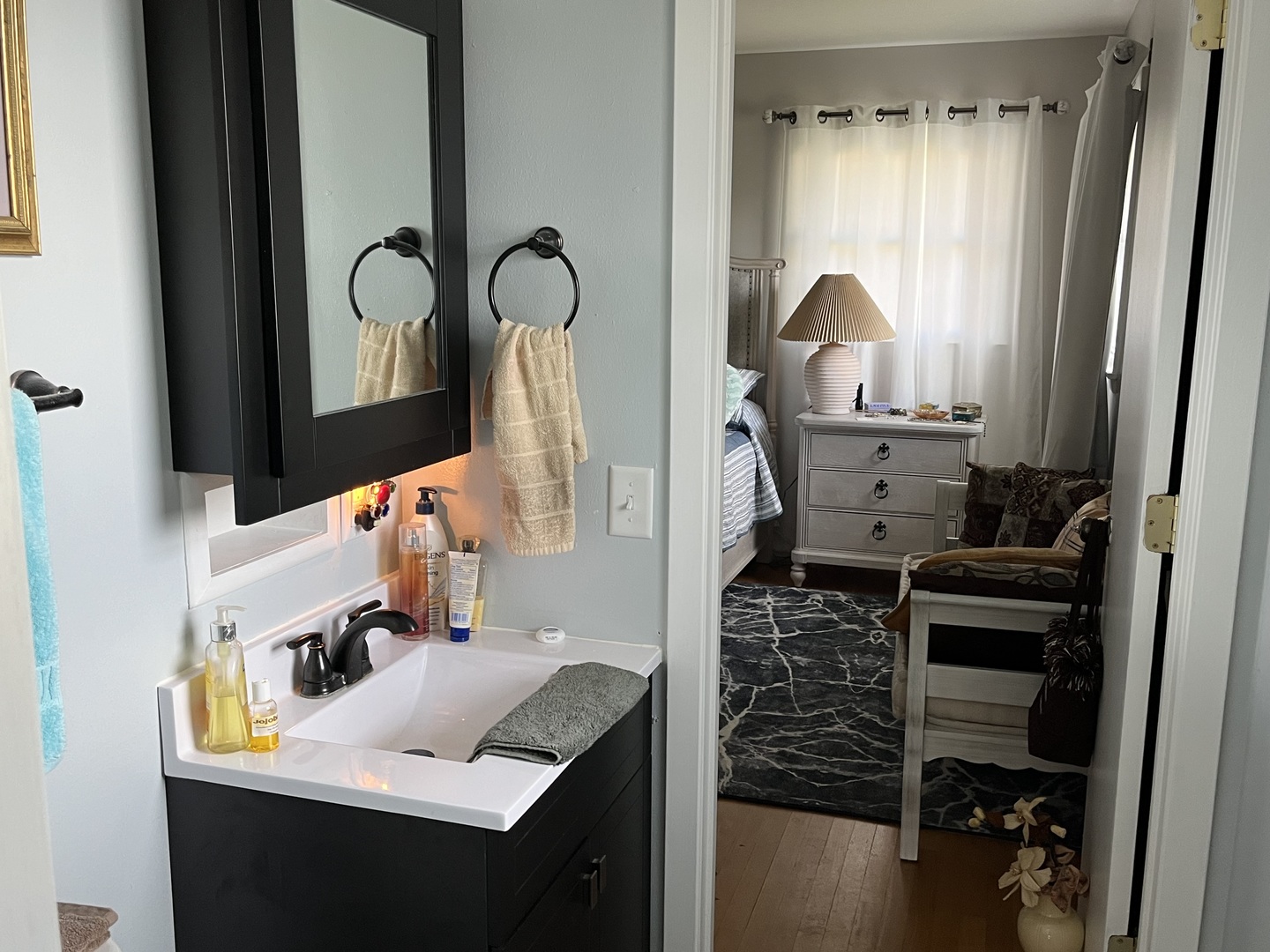 213 School Avenue Rochelle, IL 61068 - Photo 10 of 26 a bathroom with a sink and a mirror