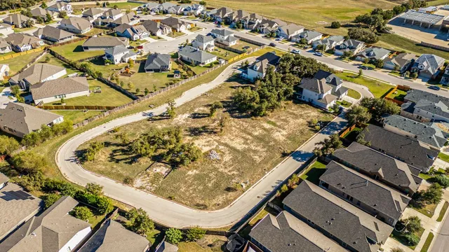 an aerial view of a highlighted house