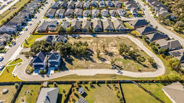 a view of swimming pool with a yard and sitting space